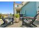 Cozy backyard patio features comfortable seating and a fire pit, perfect for outdoor entertaining at 8733 Arriba Dr, Littleton, CO 80125