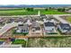 An aerial view of a fenced backyard in a community neighborhood, featuring nearby green spaces at 15376 Ivanhoe Ct, Thornton, CO 80602