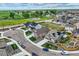 Aerial view of neighborhood featuring sidewalks, green spaces, and modern homes at 15376 Ivanhoe Ct, Thornton, CO 80602
