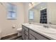 Bathroom with double sink vanity, and tub with shower at 15376 Ivanhoe Ct, Thornton, CO 80602