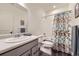 Bathroom with vanity, toilet, and tub with shower at 15376 Ivanhoe Ct, Thornton, CO 80602