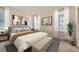 Bright bedroom featuring modern decor, neutral color scheme, and natural light at 15376 Ivanhoe Ct, Thornton, CO 80602