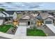 Aerial view of a single Gathering home with a two-car garage and small yard at 15376 Ivanhoe Ct, Thornton, CO 80602
