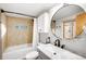 Modern bathroom featuring marble countertop, vessel sink, and a separate tub and shower at 4986 White House Trl, Evergreen, CO 80439