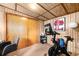 Home exercise room features panelled walls, large closet and Peloton exercise equipment at 4986 White House Trl, Evergreen, CO 80439