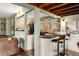 Updated kitchen with bar seating area, modern appliances, and stylish tile backsplash at 4986 White House Trl, Evergreen, CO 80439