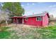 Backyard featuring a covered patio and mature tree at 16588 E 8Th Ave, Aurora, CO 80011