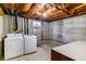 Unfinished basement laundry area with washer and dryer at 16588 E 8Th Ave, Aurora, CO 80011