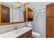 Bathroom featuring vanity, mirror, toilet, shower and cabinets at 16588 E 8Th Ave, Aurora, CO 80011