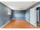 Spacious bedroom featuring hardwood floors, neutral walls, and a ceiling fan at 16588 E 8Th Ave, Aurora, CO 80011