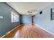 Bright living room featuring hardwood floors, neutral walls, and ample natural light at 16588 E 8Th Ave, Aurora, CO 80011