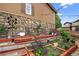 Outdoor space with a stone facade, quaint seating area and landscaped garden featuring stone pathways and decor at 436 Sage Grouse Cir, Castle Rock, CO 80109