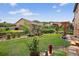 Beautifully landscaped backyard with a lush lawn, mature trees, and an inviting garden with decorative accents at 436 Sage Grouse Cir, Castle Rock, CO 80109