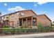 Spacious backyard featuring a covered patio, pergola swing, lush lawn and mature trees, ideal for outdoor living at 436 Sage Grouse Cir, Castle Rock, CO 80109