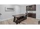 Basement entertainment area with bar, refrigerator, and dining table at 436 Sage Grouse Cir, Castle Rock, CO 80109