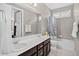 Inviting bathroom with dual sinks and a tub-shower combo, perfect for a refreshing retreat at 436 Sage Grouse Cir, Castle Rock, CO 80109