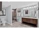 Bathroom with double vanity, tiled floors, and walk-in shower at 436 Sage Grouse Cir, Castle Rock, CO 80109