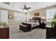 Bedroom with carpet flooring, plantation shutters, neutral walls, ceiling fan, and natural light at 436 Sage Grouse Cir, Castle Rock, CO 80109