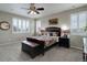 Spacious bedroom with plantation shutters, carpet floors, ceiling fan, and earth tone color palette at 436 Sage Grouse Cir, Castle Rock, CO 80109