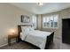 Cozy bedroom with neutral tones, plantation shutters, and soft lighting at 436 Sage Grouse Cir, Castle Rock, CO 80109