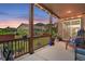 Outdoor covered patio with mountain views, string lights, and comfortable seating at 436 Sage Grouse Cir, Castle Rock, CO 80109
