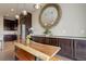 Dining area featuring custom wood table with seating, cabinets, and decor at 436 Sage Grouse Cir, Castle Rock, CO 80109