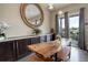 Dining area with custom wood table, and bench seating with view to deck at 436 Sage Grouse Cir, Castle Rock, CO 80109