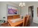 Dining room features a wood table, stylish chandelier and beautiful wall art at 436 Sage Grouse Cir, Castle Rock, CO 80109