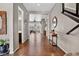 Inviting hallway with hardwood floors and an open view to the living room at 436 Sage Grouse Cir, Castle Rock, CO 80109