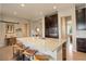 Modern kitchen featuring a large granite island with bar stool seating and stainless steel appliances at 436 Sage Grouse Cir, Castle Rock, CO 80109