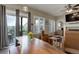 Comfortable living room with stylish wood table, leather chairs and outdoor access at 436 Sage Grouse Cir, Castle Rock, CO 80109
