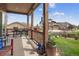 Covered patio with views of neighborhood and lush landscaping at 436 Sage Grouse Cir, Castle Rock, CO 80109