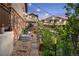 A garden pathway with stone accents, string lights, and lush greenery at 436 Sage Grouse Cir, Castle Rock, CO 80109