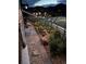 Charming side yard with stone pathways, garden beds, and string lights for a magical outdoor ambiance at 436 Sage Grouse Cir, Castle Rock, CO 80109