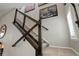 View of staircase with carpeted steps, modern railing, and stylish wall decor at 436 Sage Grouse Cir, Castle Rock, CO 80109