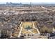 Aerial view of a suburban neighborhood featuring a green space and playground, surrounded by well-maintained homes at 6792 Navajo Way, Denver, CO 80221