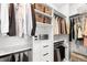 Organized walk-in closet featuring custom shelving, hanging rods, and ample storage space, perfect for all your wardrobe needs at 6792 Navajo Way, Denver, CO 80221