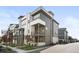 Modern multi-story townhome featuring a balcony, contemporary design, and landscaped surroundings at 6792 Navajo Way, Denver, CO 80221