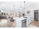 Open living area with a modern kitchen, dining area and access to the living room at 6792 Navajo Way, Denver, CO 80221