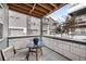 Cozy covered patio with outdoor seating perfect for relaxing and enjoying the neighborhood view at 6792 Navajo Way, Denver, CO 80221