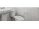 Bathroom featuring a modern sink, toilet, and a neutral color scheme at 6814 Merseyside Ln, Castle Pines, CO 80108