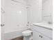 Bright bathroom features white tiled shower and white vanity at 6814 Merseyside Ln, Castle Pines, CO 80108