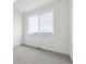 Bright bedroom with a large window and neutral carpet at 6814 Merseyside Ln, Castle Pines, CO 80108