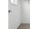 This closet features carpet and built-in clothes hanger rod at 6814 Merseyside Ln, Castle Pines, CO 80108