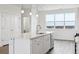 Bright kitchen features a center island, stainless steel appliances, and a view of the outdoors at 6814 Merseyside Ln, Castle Pines, CO 80108