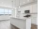 Modern kitchen with white cabinets, quartz countertops, and stainless steel appliances at 6814 Merseyside Ln, Castle Pines, CO 80108
