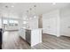 Open-concept living area featuring hardwood floors, recessed lighting, and access to an open concept kitchen at 6814 Merseyside Ln, Castle Pines, CO 80108
