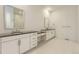 Modern bathroom featuring dual vanities, sleek countertops, and contemporary fixtures for a luxurious feel at 3877 Treadway Pt, Castle Rock, CO 80108
