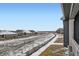 Wide shot from house showing neighboring houses and open field at 3877 Treadway Pt, Castle Rock, CO 80108