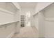 Walk-in closet with shelving and clothes racks for ample storage at 3877 Treadway Pt, Castle Rock, CO 80108
